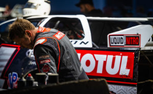 Larson works on his car