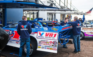 The Rocket1 Racing team works on the car at Jackson Motorplex