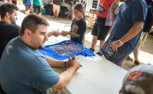Gustin signs autographs