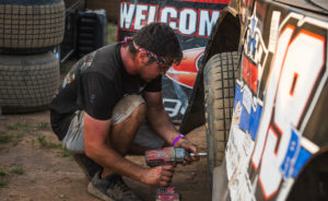 Noah Bushman works on Ryan Gustin's Late Model