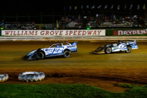 Gregg Satterlee and Kyle Larson battle for the lead