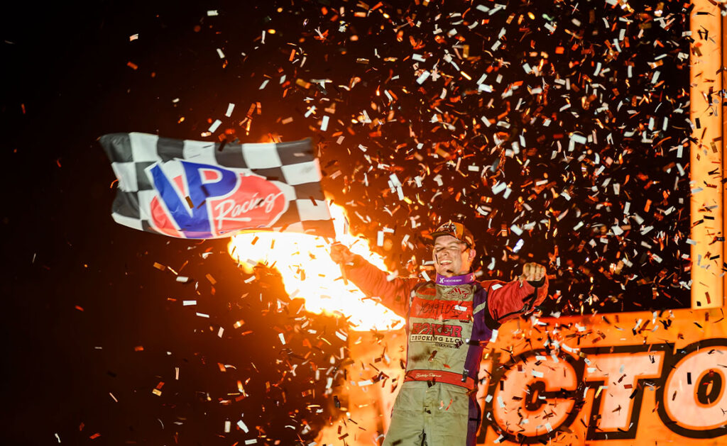 Bobby Pierce celebrates his win at I-94 emr Speedway