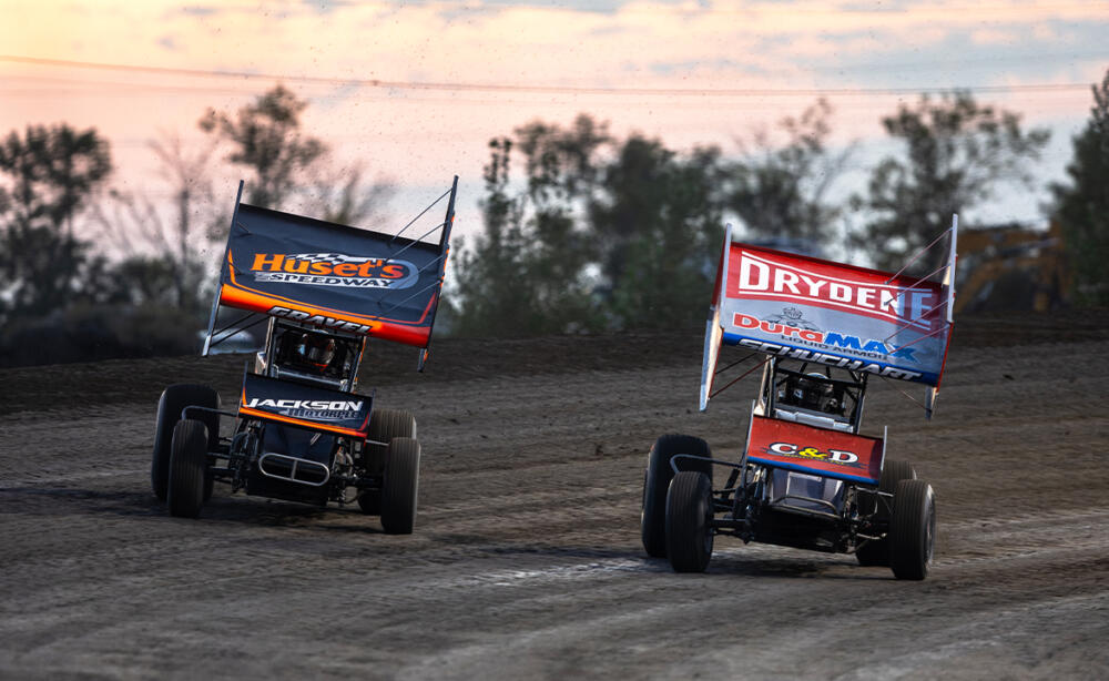 Logan Schuchart races next to David Gravel