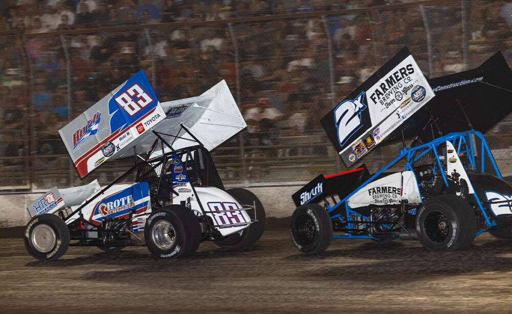Buddy Kofoid races just ahead of Justin Sanders