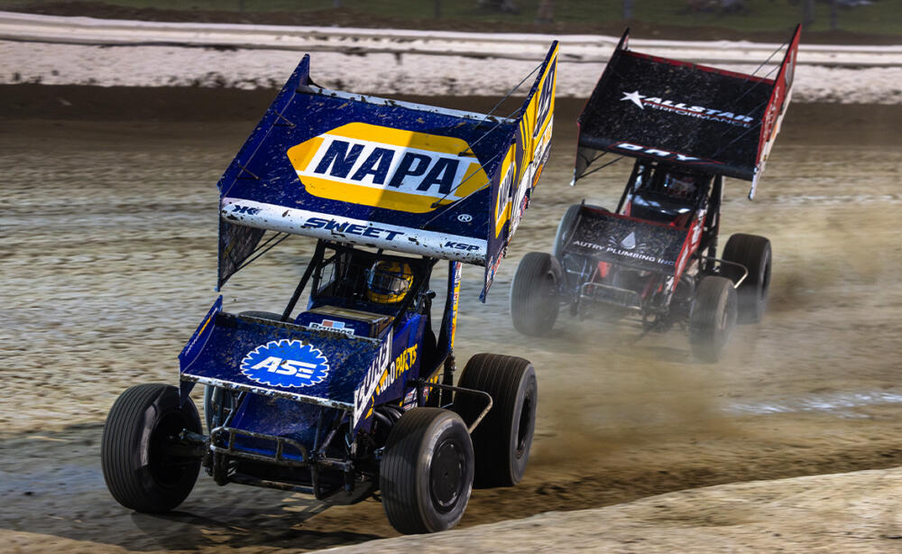 Brad Sweet races in front of Corey Day