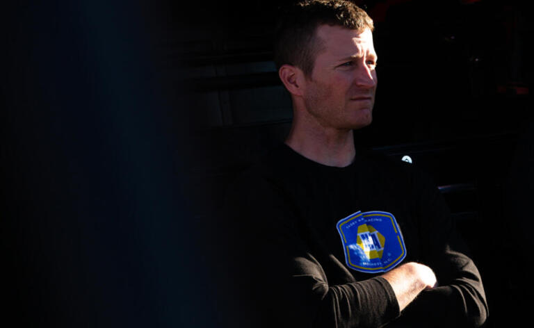 Kasey Kahne stands with arms crossed