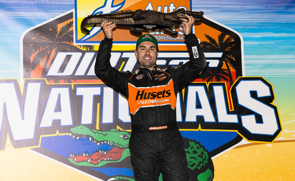 David Gravel lifts the Big Gator trophy above his head