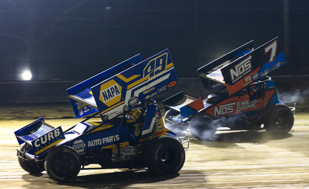 Brad Sweet races just ahead of Tyler Courtney at Volusia Speedway Park