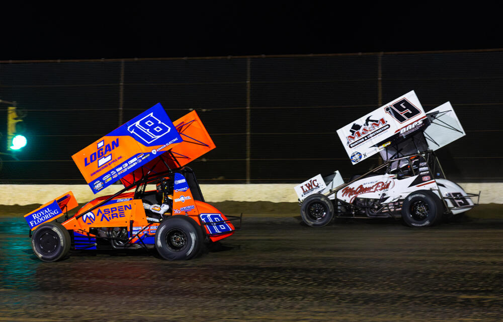 Giovanni Scelzi races ahead of Brent Marks at Cotton Bowl Speedway