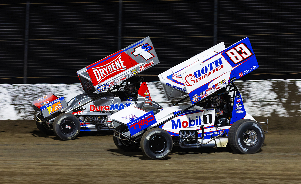 Michael "Buddy" Kofoid and Logan Schuchart race side by side