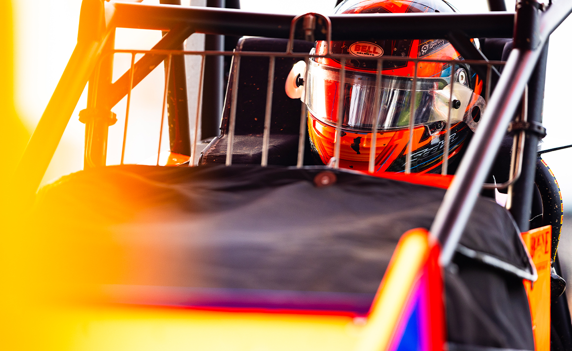 Giovanni Scelzi sits in the KCP Racing #18 with his helmet on