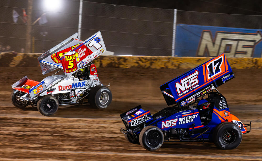 Logan Schuchart races just ahead of Sheldon Haudenschild at Cedar Lake