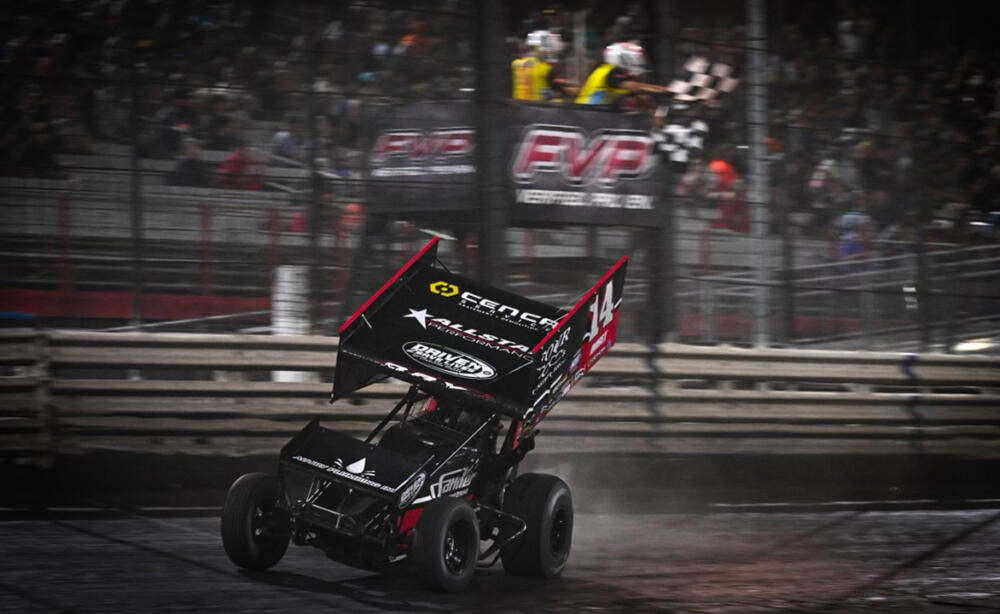 Corey Day drives under the checkered flag in the Jason Meyers Racing No. 14