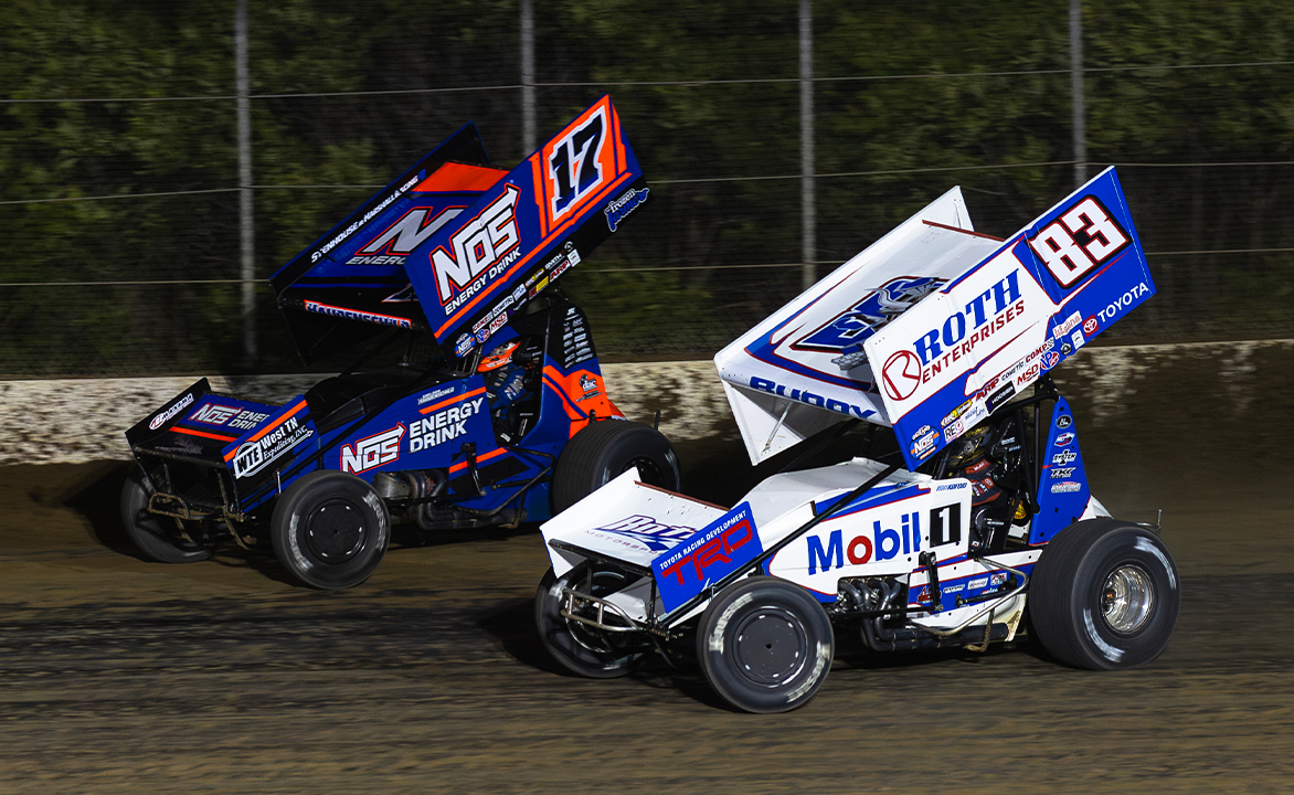 Buddy Kofoid races next to Sheldon Haudenschild