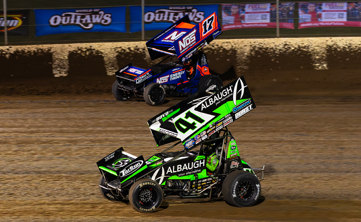 Sheldon Haudenschild racing next to Carson Macedo