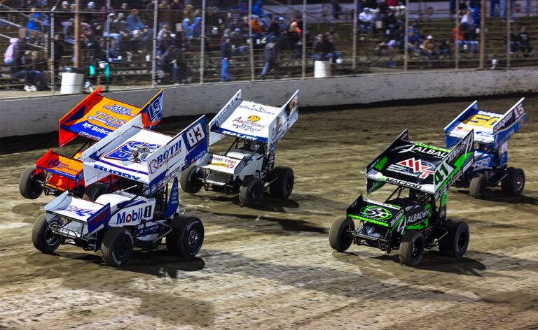 The World of Outlaws NOS Energy Drink Sprint Cars take the green flag on a Toyota Dash at I-55