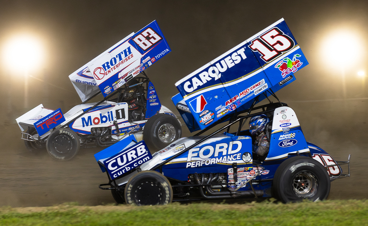 Donny Schatz races underneath Buddy Kofoid at Wilmot Raceway