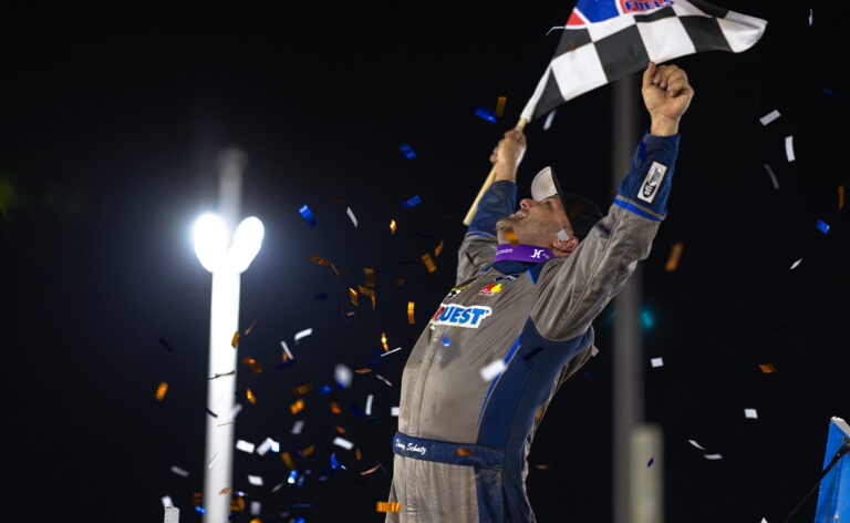 Donny Schatz celebrates with a wing dance and looks toward the sky.