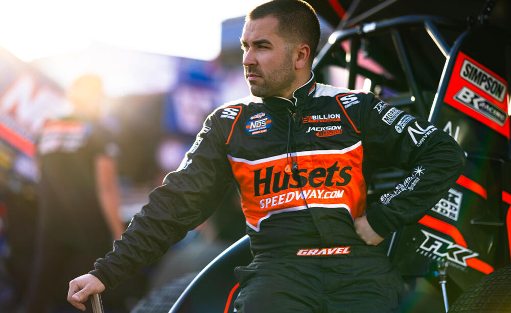 David Gravel sits on the tail tank of the Big Game Motorsports No. 2