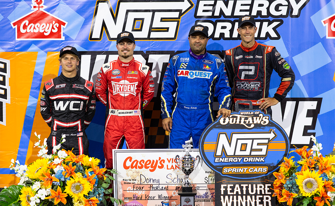 Emerson Axsom, Logan Schuchart, Donny Schatz, and Justin Henderson stand in Knoxville Raceway Victory Lane