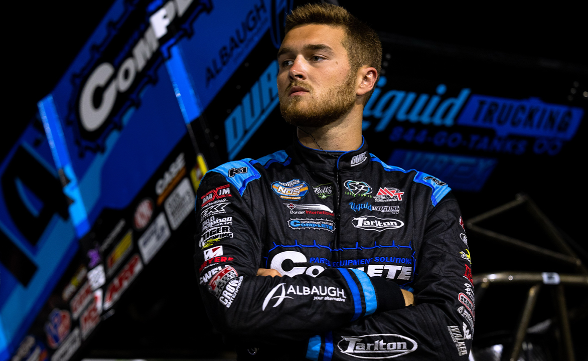 Cole Macedo stands in the pit area at Knoxville Raceway