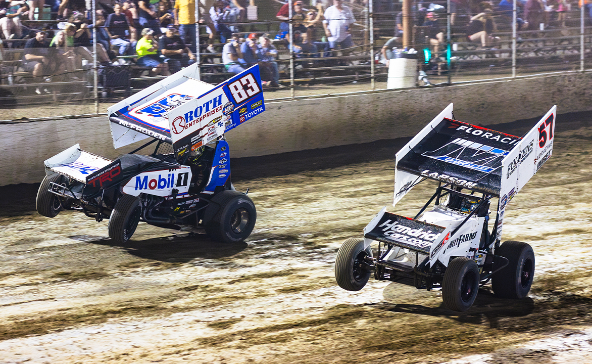 Kyle Larson races under James McFadden to the checkered flag at I-55