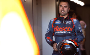 David Gravel stands in the Big Game Motorsports trailer