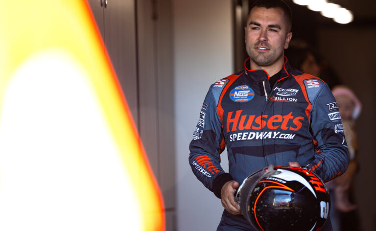 David Gravel stands in the Big Game Motorsports trailer