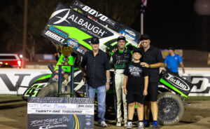 Carson Macedo celebrates with Tom and Tommy Tarlton