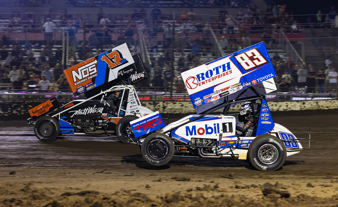 Buddy Kofoid races to Shane Golobic's inside at Stockton Dirt Track