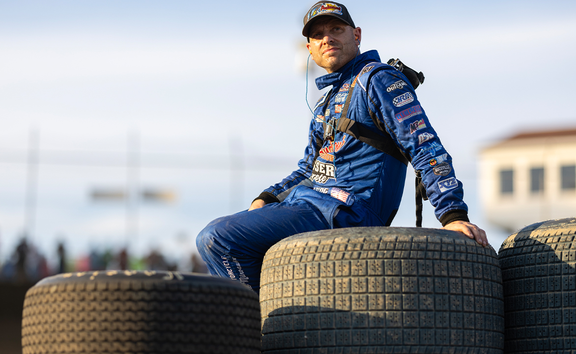 Bill Balog sits atop a Hoosier tire