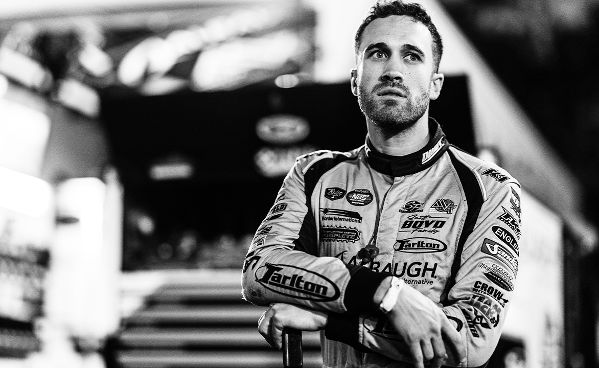 Carson Macedo standing in his fire suit