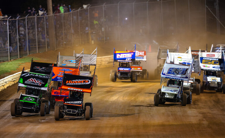 Sprint Cars race down the front straightaway at Lincoln Speedway