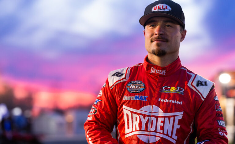 Logan Schuchart standing in his Drydene fire suit