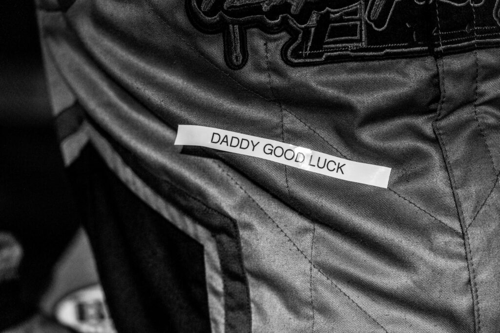 Label on Dillard's firesuit says "Daddy Good Luck"
