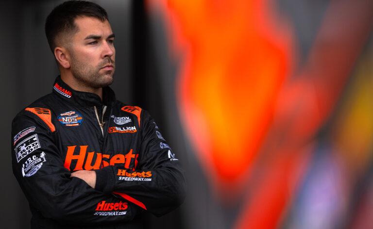 David Gravel stands in the Big Game Motorsports hauler