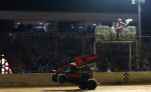David Gravel does a wheelie across the finish line at Cotton Bowl Speedway