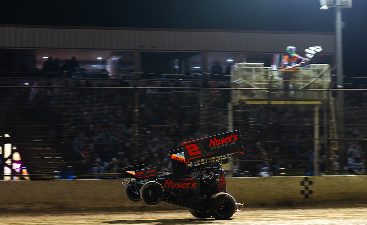 David Gravel does a wheelie across the finish line at Cotton Bowl Speedway