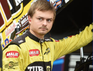 Conner Morrell stands by the No. 28 Sprint Car