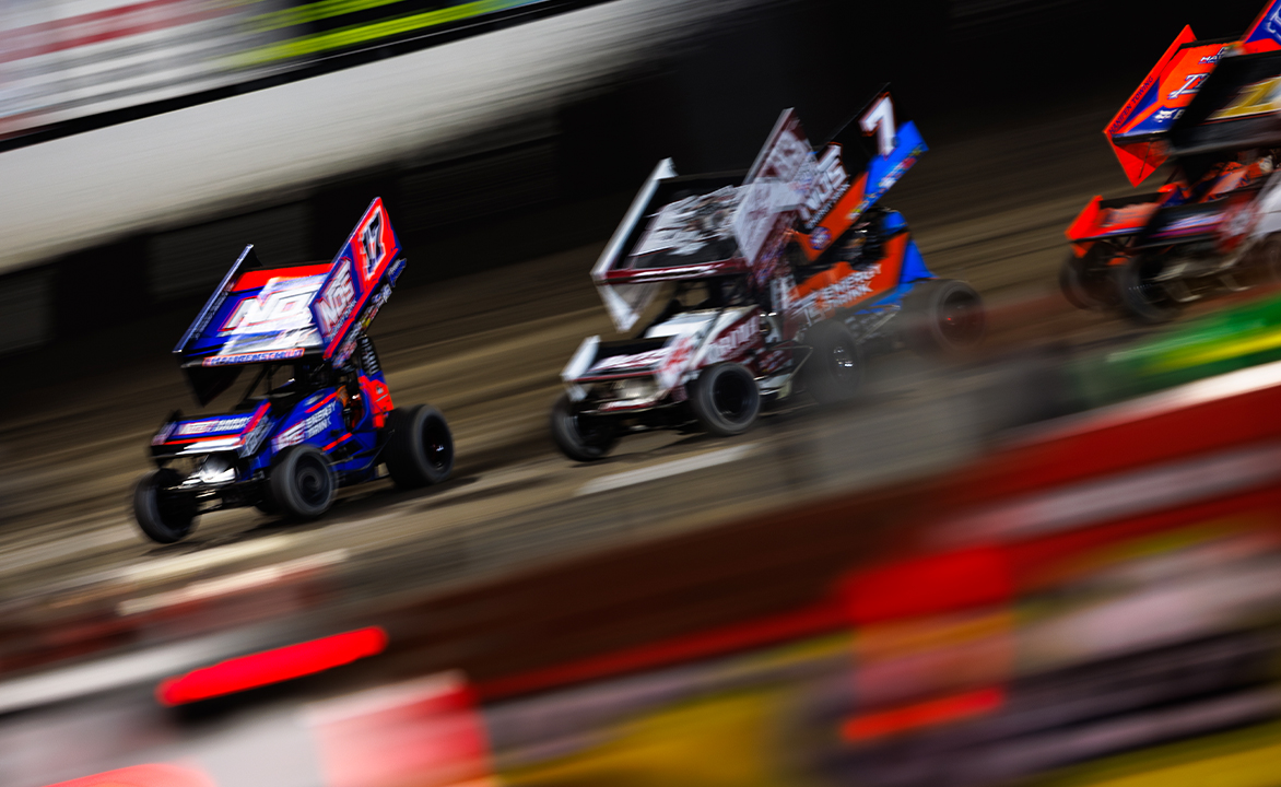 Sheldon Haudenschild, Buddy Kofoid, and Tyler Courtney racing for the win at Tri-State Speedway