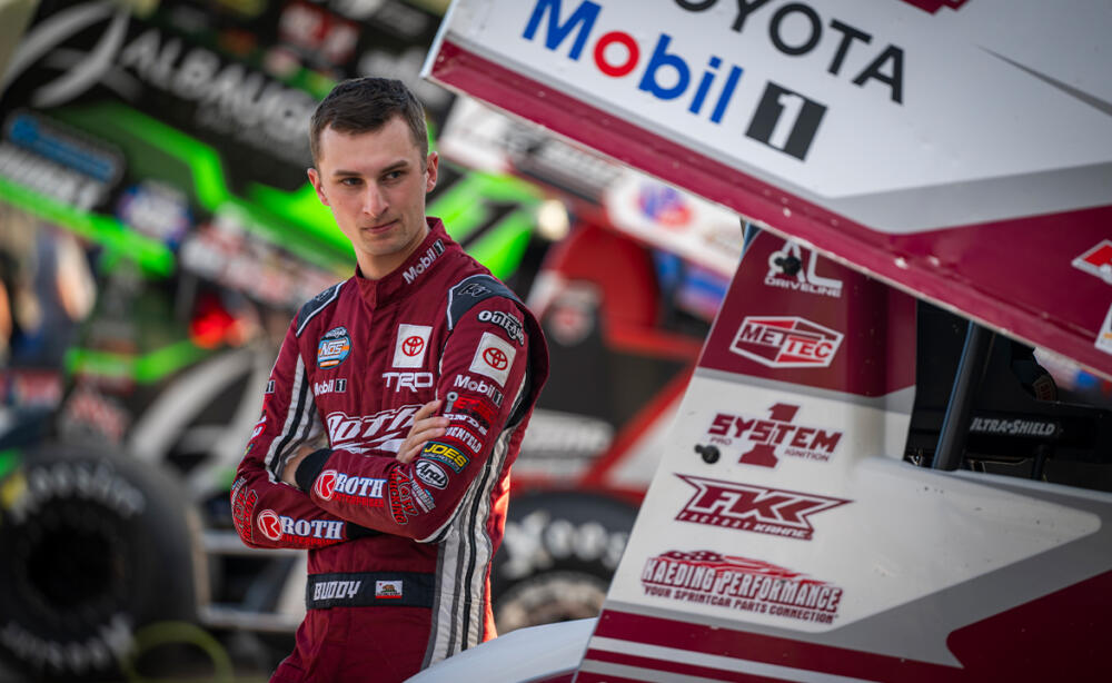 Buddy Kofoid standing next to the Roth Motorsports Sprint Car