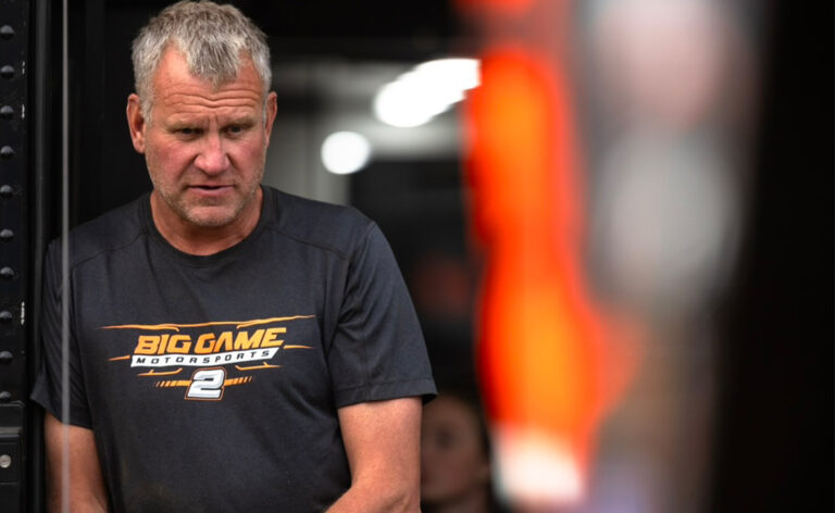 Pete Stephens stands in the Big Game Motorsports hauler