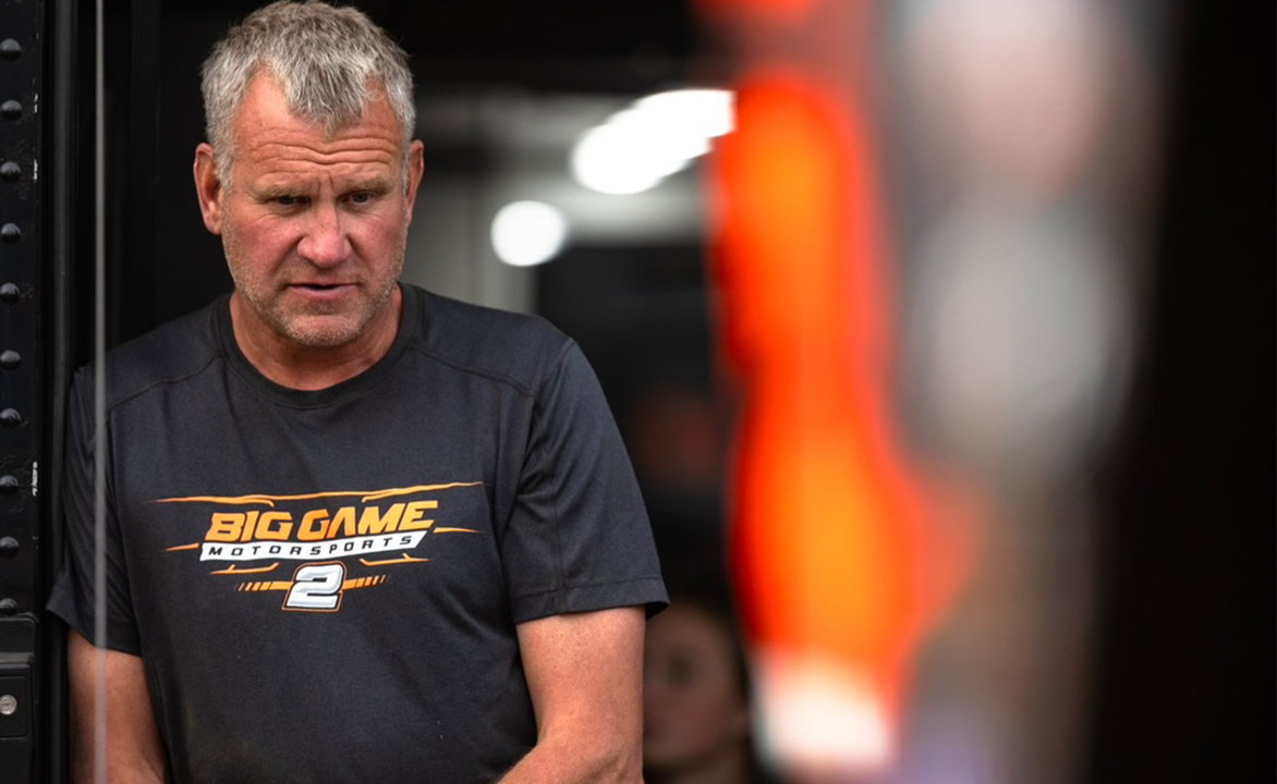 Pete Stephens stands in the Big Game Motorsports hauler
