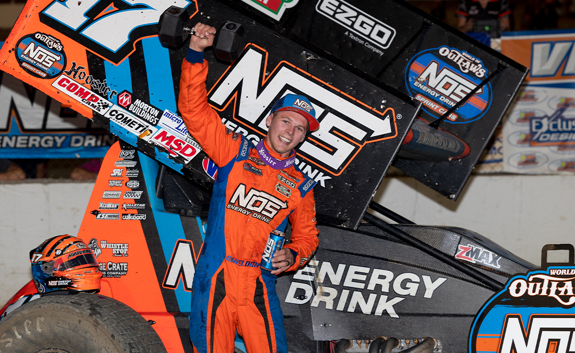 Sheldon Haudenschild celebrates winning the 2021 Ironman 55