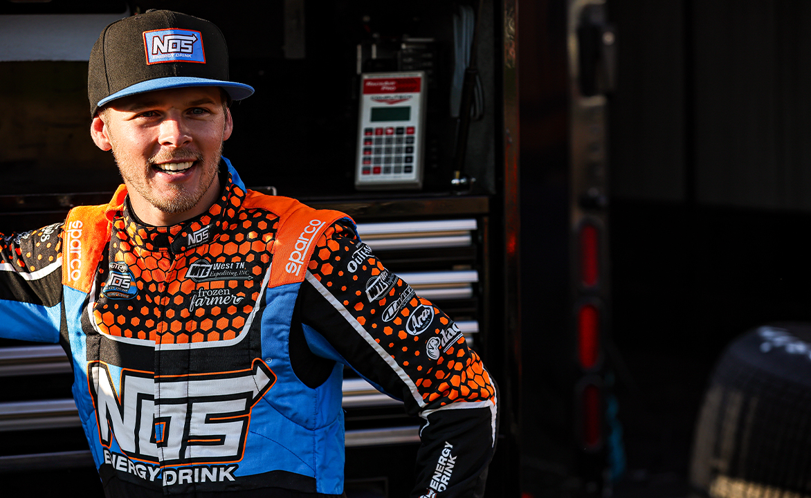 Sheldon Haudenschild smiling in his fire suit