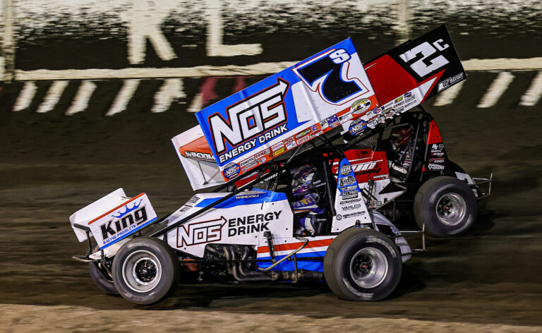 Chris Windom races side by side with Cole Macedo