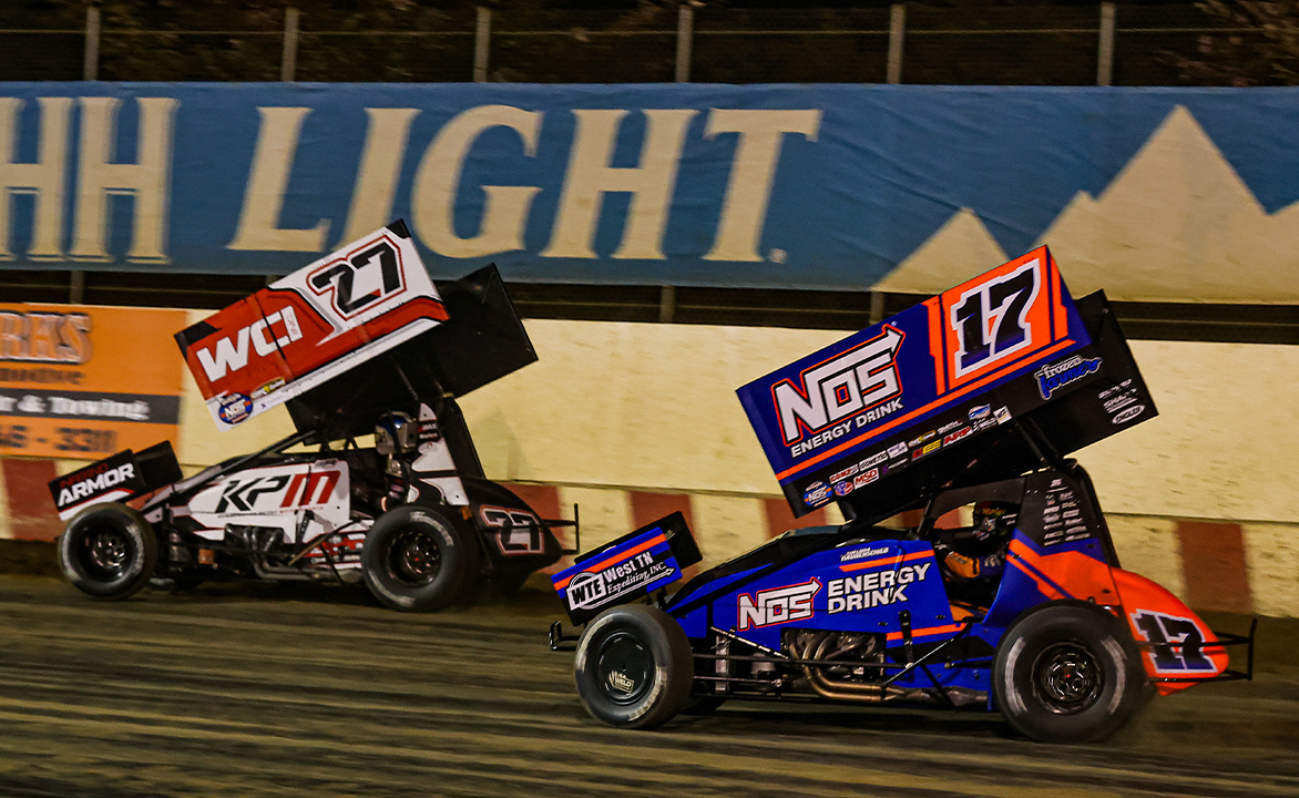 Emerson Axsom races ahead of Sheldon Haudenschild at Angell Park Speedway