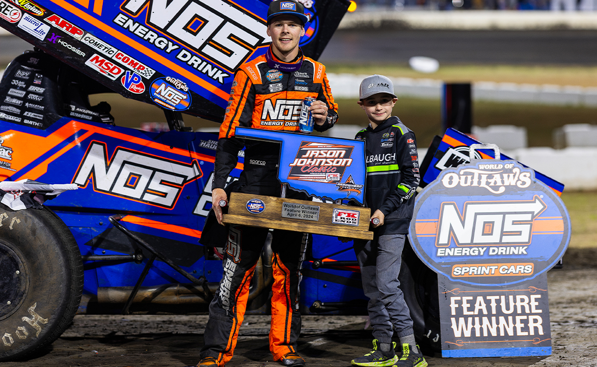 Sheldon Haudenschild and Jaxx Johnson holding the Jason Johnson Classic trophy