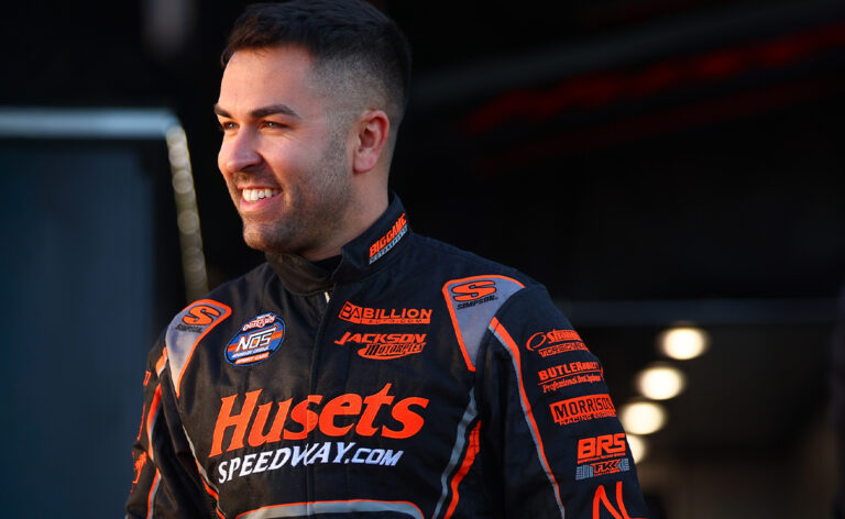 David Gravel smiling in his fire suit
