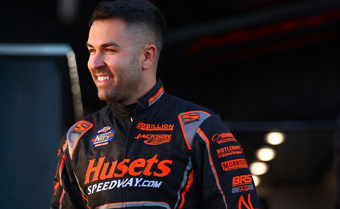 David Gravel smiling in his fire suit